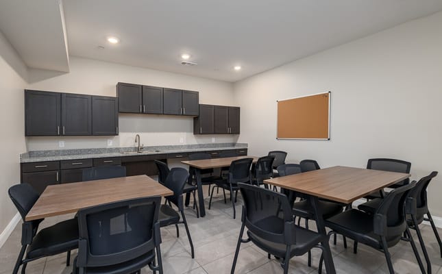 Empty dining area with tables and chairs