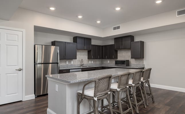 Modern kitchen with granite countertops and seating