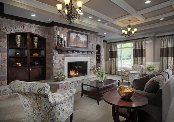 Inviting living room with a stone fireplace