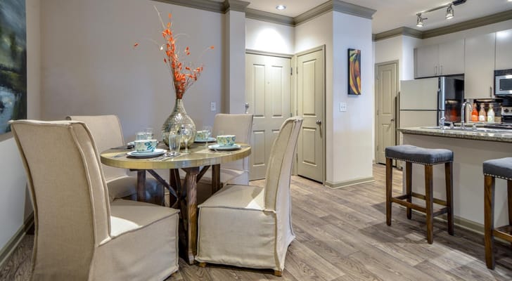 Stylish dining area with table and chairs in a modern interior