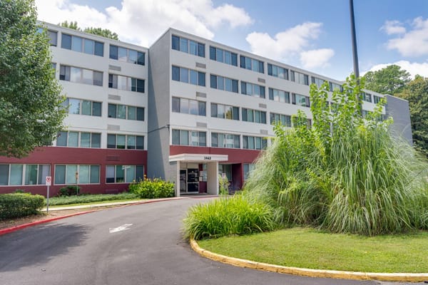 Exterior view of Lenox Summit Apartments with greenery