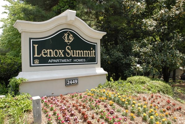 Sign for Lenox Summit Apartments with flowers
