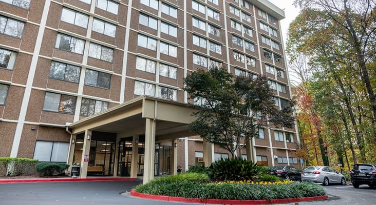Main entrance of Smyrna Towers with landscaping