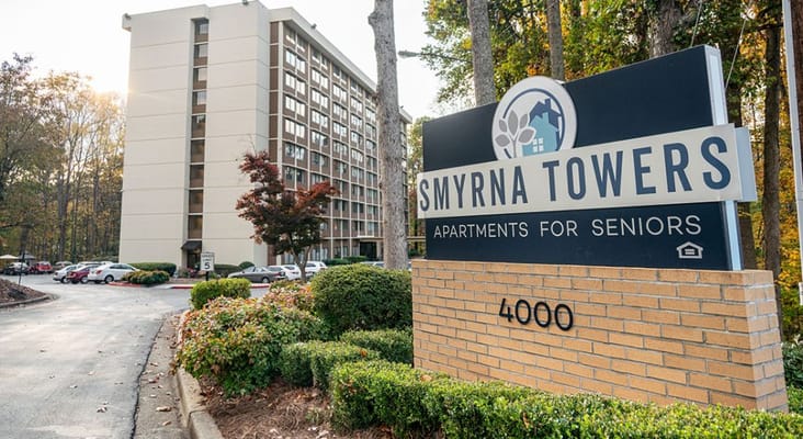 Sign for Smyrna Towers Senior Apartments at the entrance.