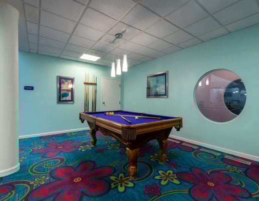 Pool table in a vibrant activity room