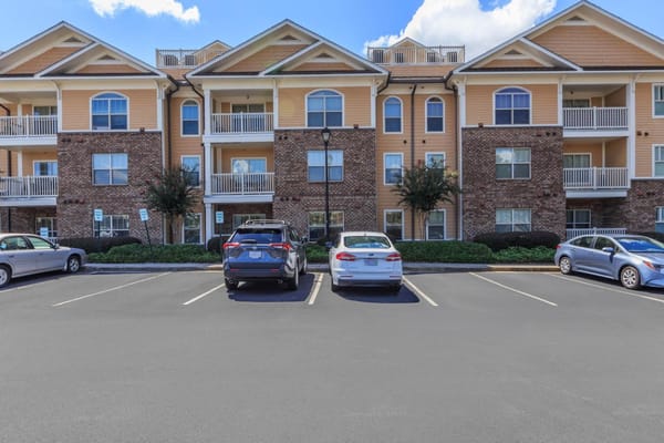 Exterior view of Galleria Manor facilities with parking