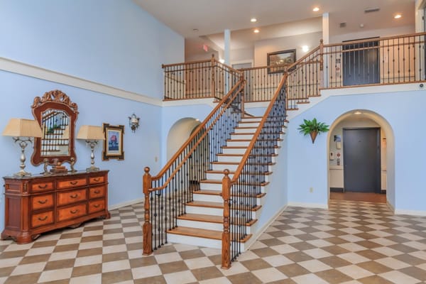 Interior view of a welcoming lobby with a staircase