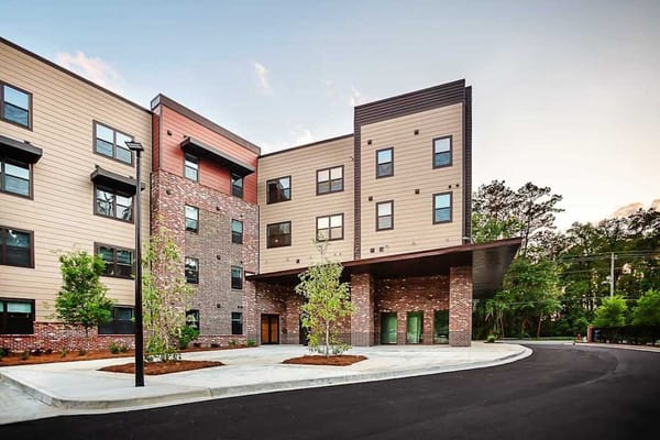 Exterior view of The Ashbury facility with landscaped entry