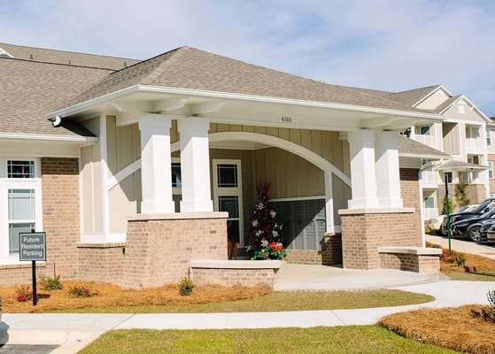 Exterior view of the entrance with future resident parking