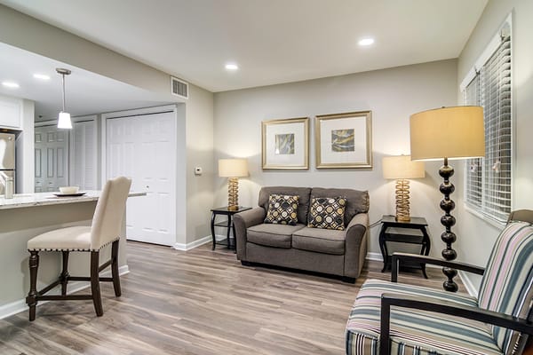 Warm living room with seating and decorative lamps