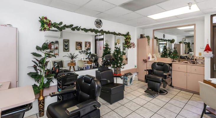 Hair salon interior with styling chairs and decor