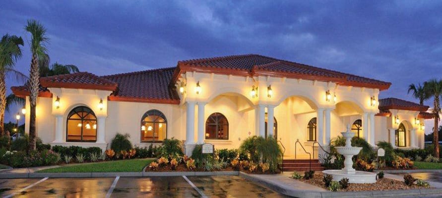 Exterior view of the Village Green clubhouse at twilight