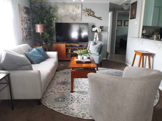 Comfortable living room with a sofa, chairs, and a coffee table