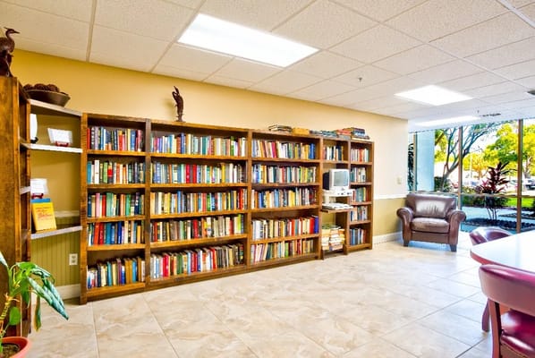 Bookshelves in a cozy reading area with a leather chair