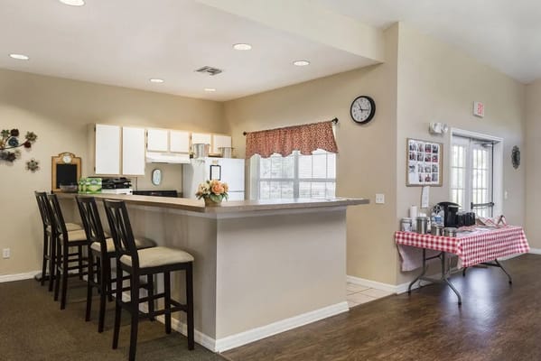 Bright common area with a kitchen and seating