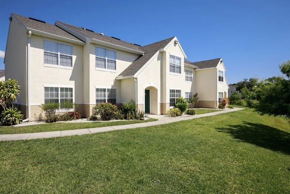 Exterior view of a residential building with landscaped area