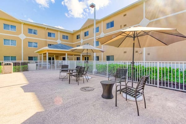 Outdoor seating area with umbrellas in a courtyard