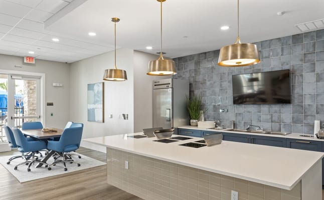 Modern kitchen area with dining space and modern fixtures