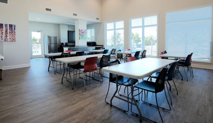 Bright common area with tables and chairs