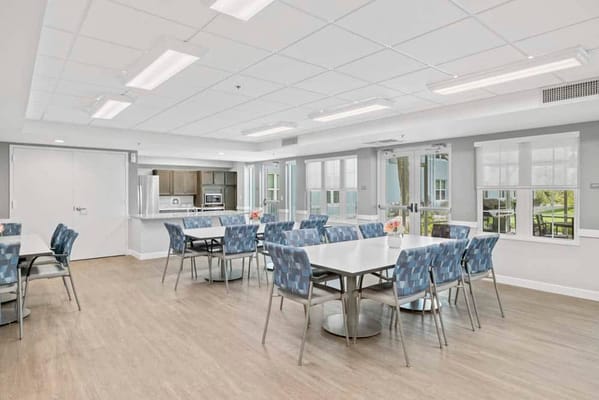 Bright dining area with tables and chairs