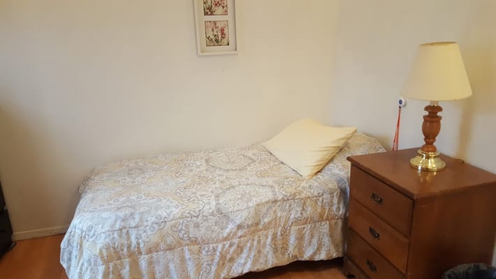 Cozy single bed in a private resident room