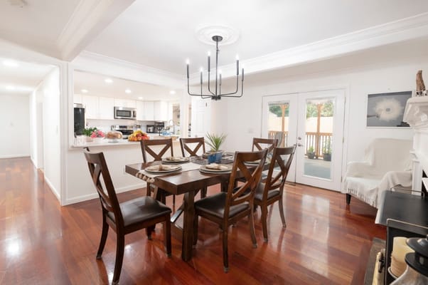 Bright dining area with a wooden table and chairs