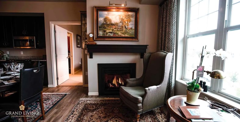 Cozy lounge area with fireplace and artwork