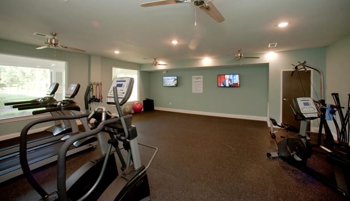 Interior view of a fitness room with exercise equipment