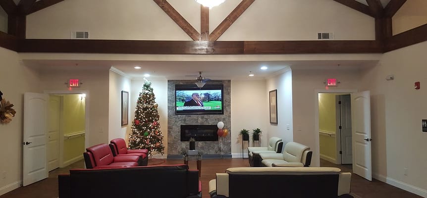 Interior view of a cozy common area with seating and holiday decor