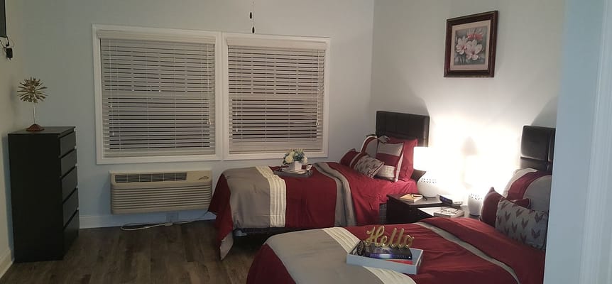 A well-decorated shared bedroom with two beds