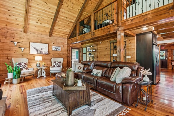 Warm wooden living room with comfortable seating and decor