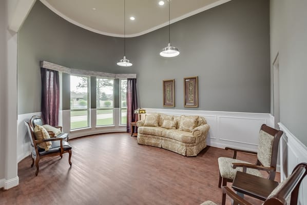 Cozy living room with large windows and comfortable seating