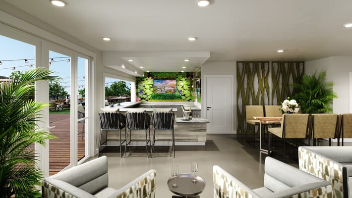 Stylish lounge with bar seating and greenery.