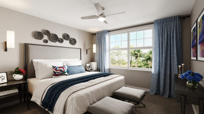 Stylish bedroom with a bed, decorative pillows, and a view out the window