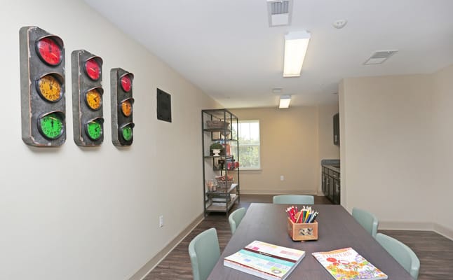 Activity room with a table and wall decor