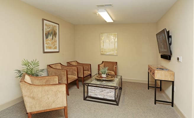 Cozy lounge area with chairs and a coffee table