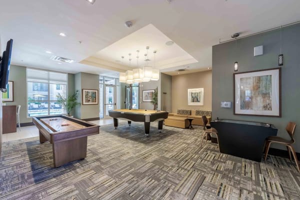 Common area with pool table and seating