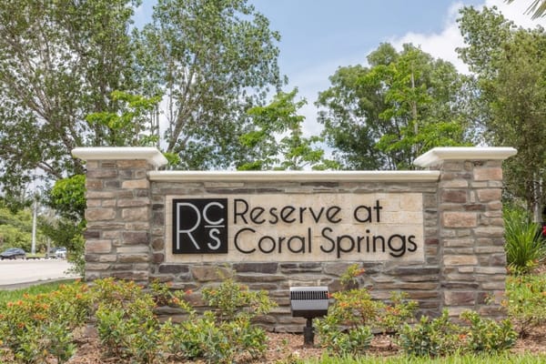 Facility logo on a stone sign