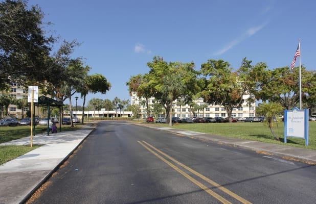 View of St. Andrews Towers entrance with parking area.