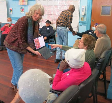 Residents engaging in a group activity with a facilitator