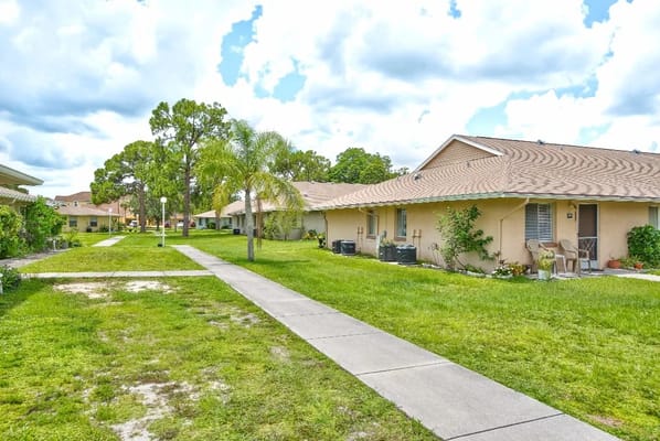 Pathway with residential units and green landscaping