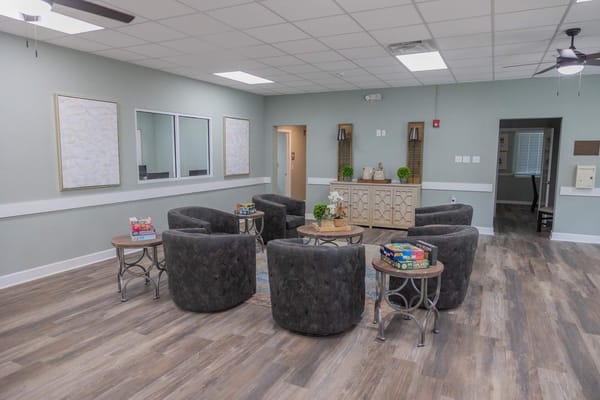 Common area with comfortable seating and games