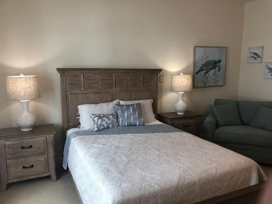 Cozy private resident room with bed and seating area