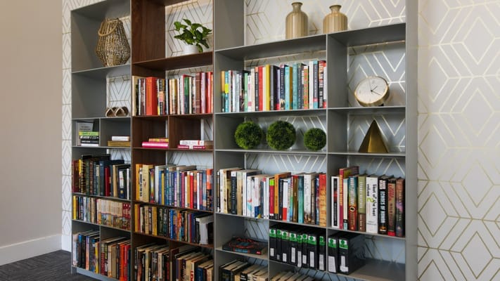 Interior bookshelf with a selection of books and decor