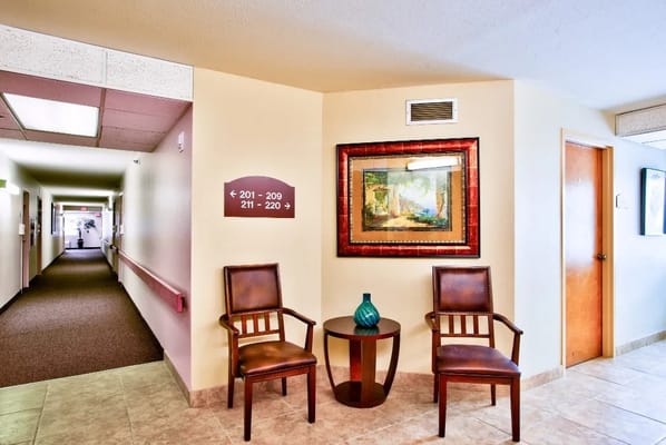 Interior hallway with seating area and art