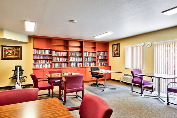 Interior view of a cozy common area with bookshelves