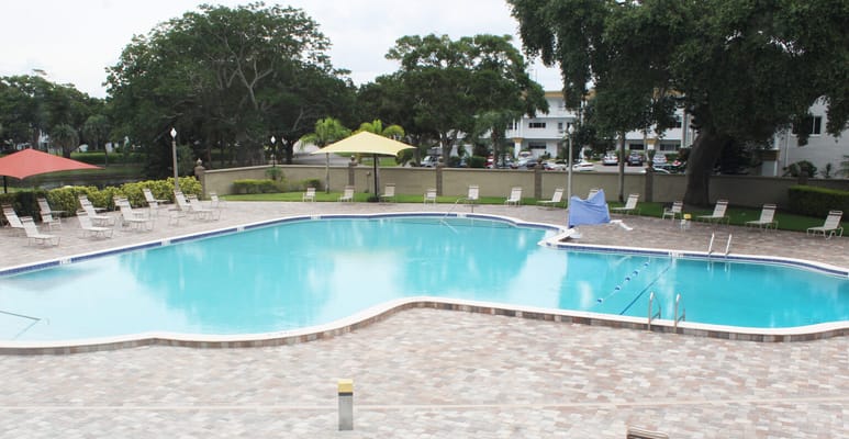 Swimming pool surrounded by lounge chairs