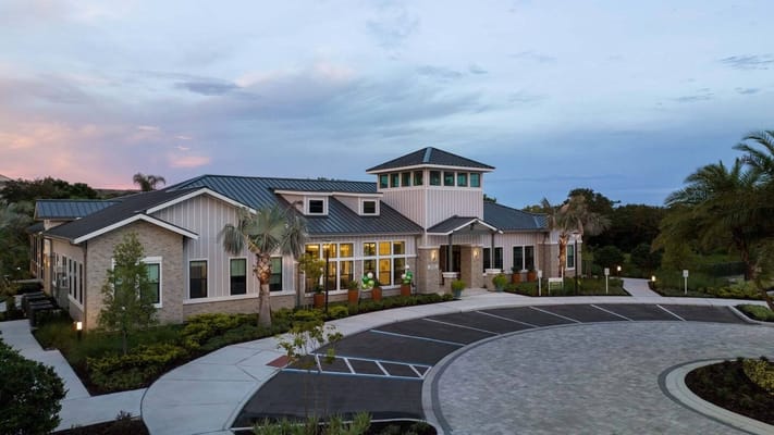 Exterior view of Windsor Clearwater Apartments with landscaped entrance