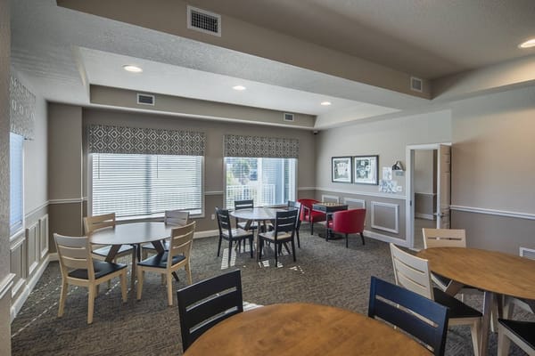 Bright common area with seating and tables