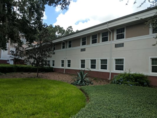 Exterior view of the facility surrounded by landscaping